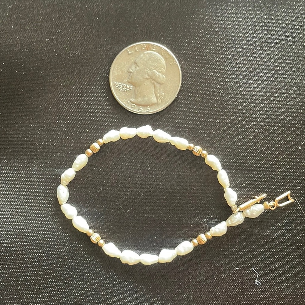 Children’s mother of pearl and gold bracelets